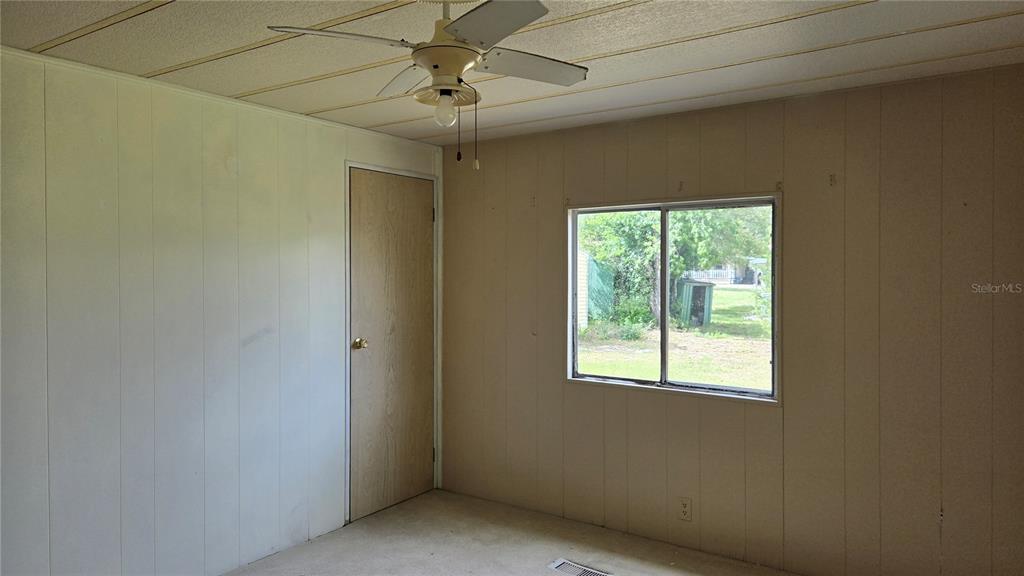5921 Southwest 63rd Street Ocala, FL 34474 - Photo 19 of 24 a view of a livingroom with a window and a ceiling fan