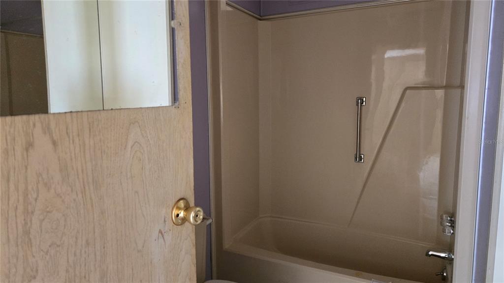 5921 Southwest 63rd Street Ocala, FL 34474 - Photo 21 of 24 a bathroom with a shower