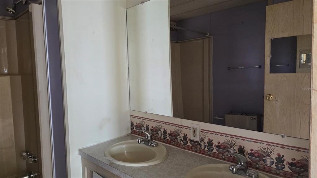 5921 Southwest 63rd Street Ocala, FL 34474 - Photo 22 of 24 a bathroom with a sink and a mirror