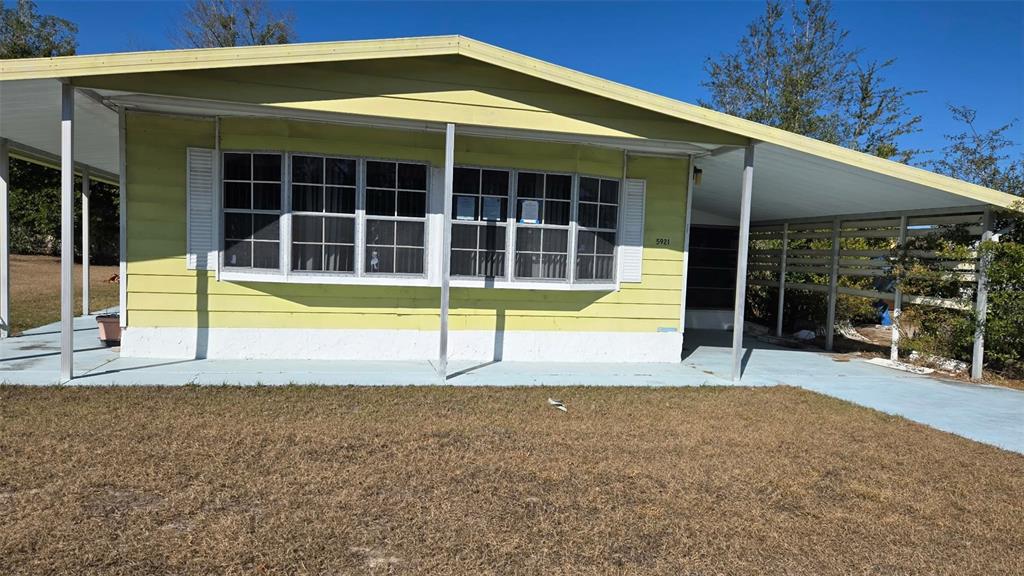 5921 Southwest 63rd Street Ocala, FL 34474 - Photo 3 of 24 a view of a house with a swimming pool