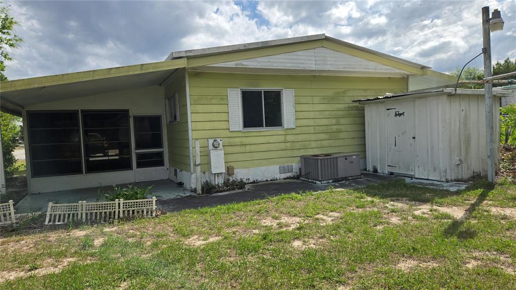 5921 Southwest 63rd Street Ocala, FL 34474 - Photo 5 of 24 a view of house with backyard and porch