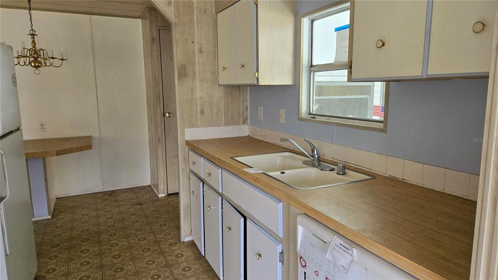 5921 Southwest 63rd Street Ocala, FL 34474 - Photo 8 of 24 a bathroom with a sink and a mirror