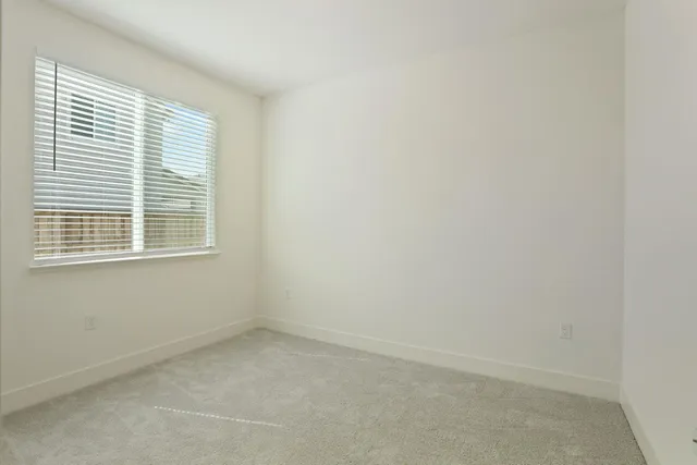 a kitchen with a stove a sink and a refrigerator