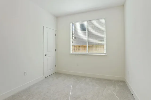 a kitchen that has a sink a stove and a table