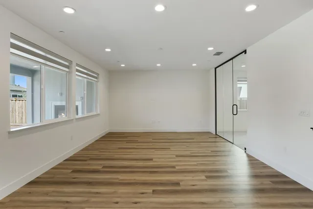 a view of staircase with lots of furniture and windows