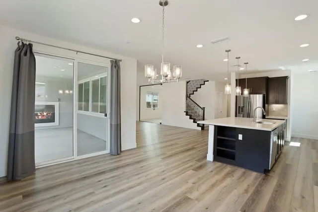 a bathroom with a double vanity sink a mirror and a shower