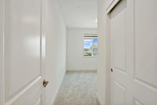 a view of a house with a wooden fence