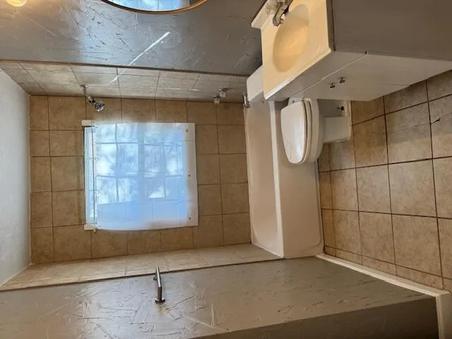 a view of an empty room and window