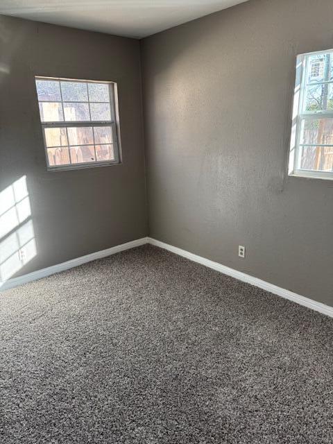 2710 East 3rd Street Lubbock, TX 79403 - Photo 6 of 9 an empty room with a window