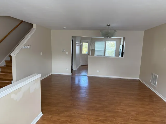 a view of livingroom with hardwood floor and hallway