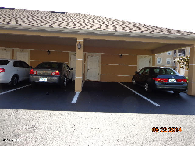 3848 Lexmark Lane, Unit 208 Rockledge, FL 32955 - Photo 13 of 16 Carport with Secure Storage Room