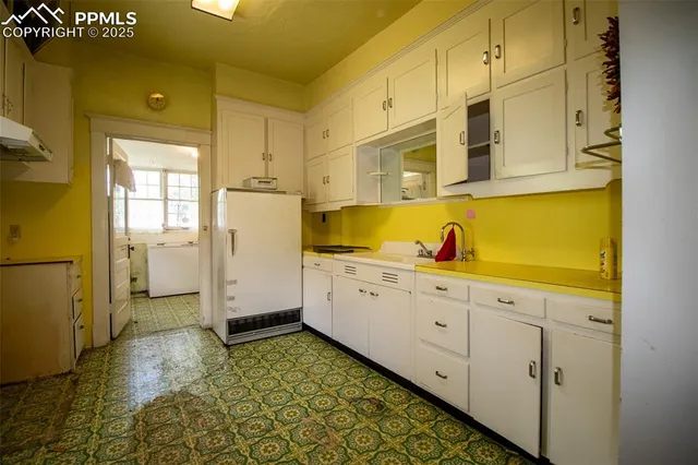a bathroom with a sink a mirror and a shower