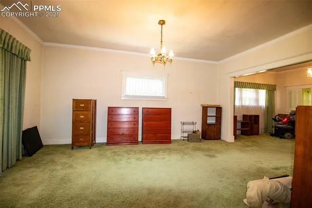 a livingroom with furniture cabinet and window