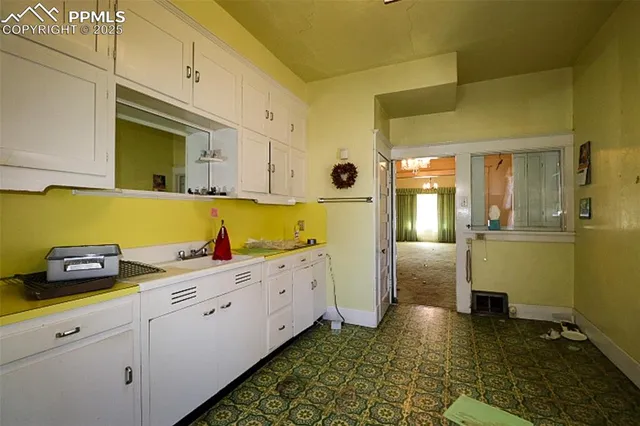 a bathroom with a sink a toilet and a shower