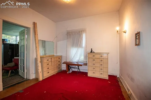 a bedroom with a bed and a table