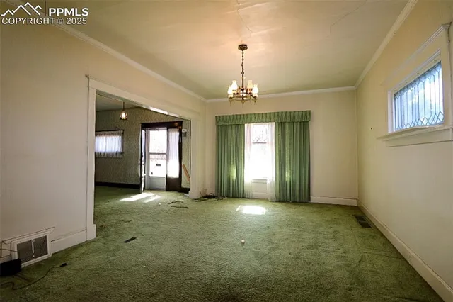 a view of a room with window and chandelier