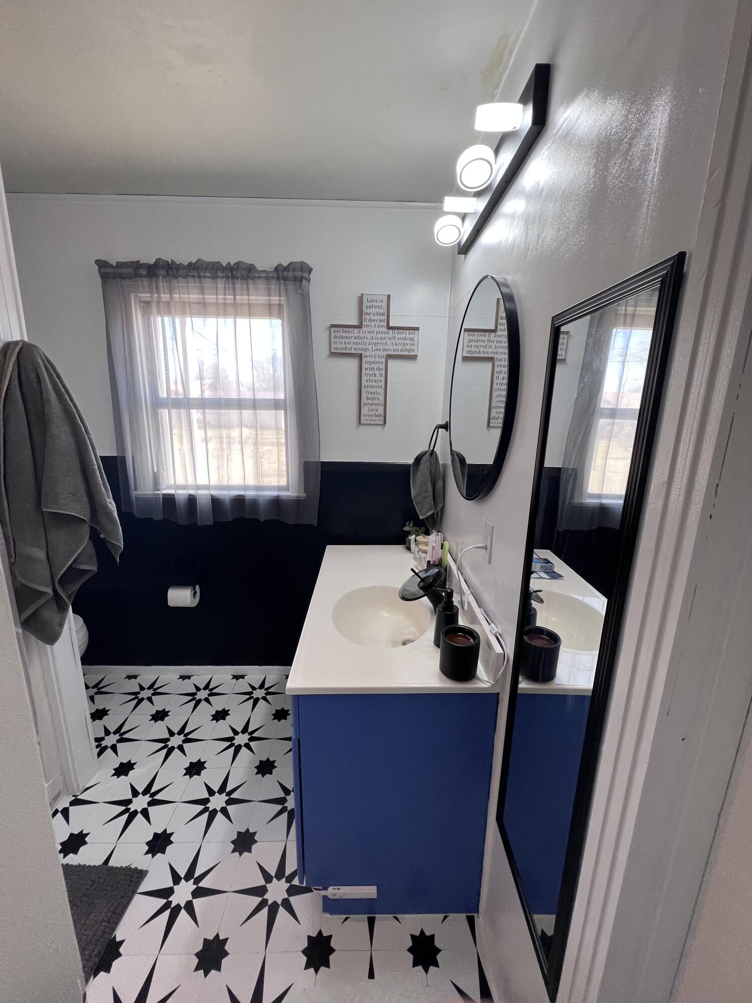 502 Main Street Anton, TX 79313 - Photo 11 of 16 a bathroom with a sink a toilet and a mirror