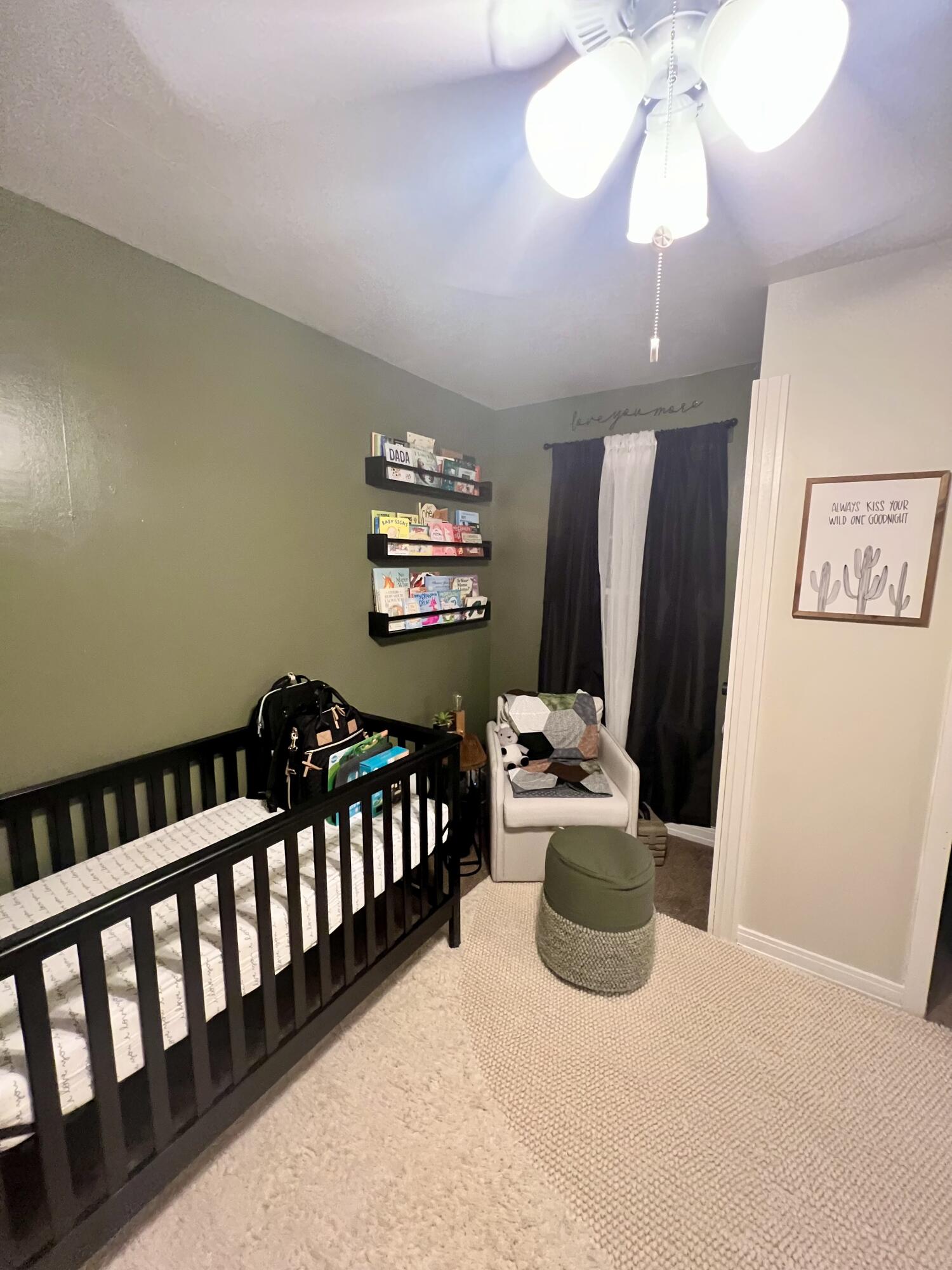 502 Main Street Anton, TX 79313 - Photo 16 of 16 a bedroom with furniture and a chandelier