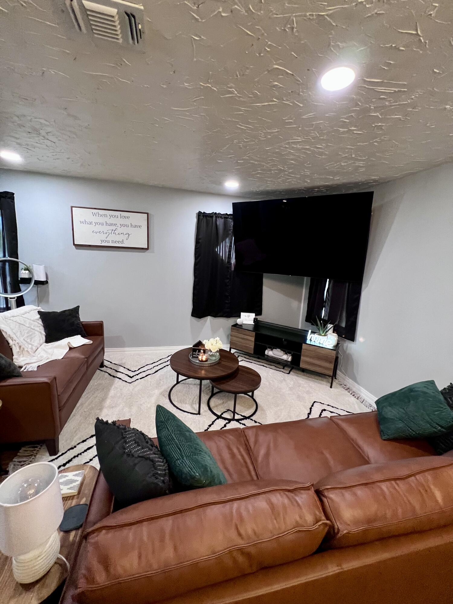 502 Main Street Anton, TX 79313 - Photo 4 of 16 a living room with furniture and a fireplace