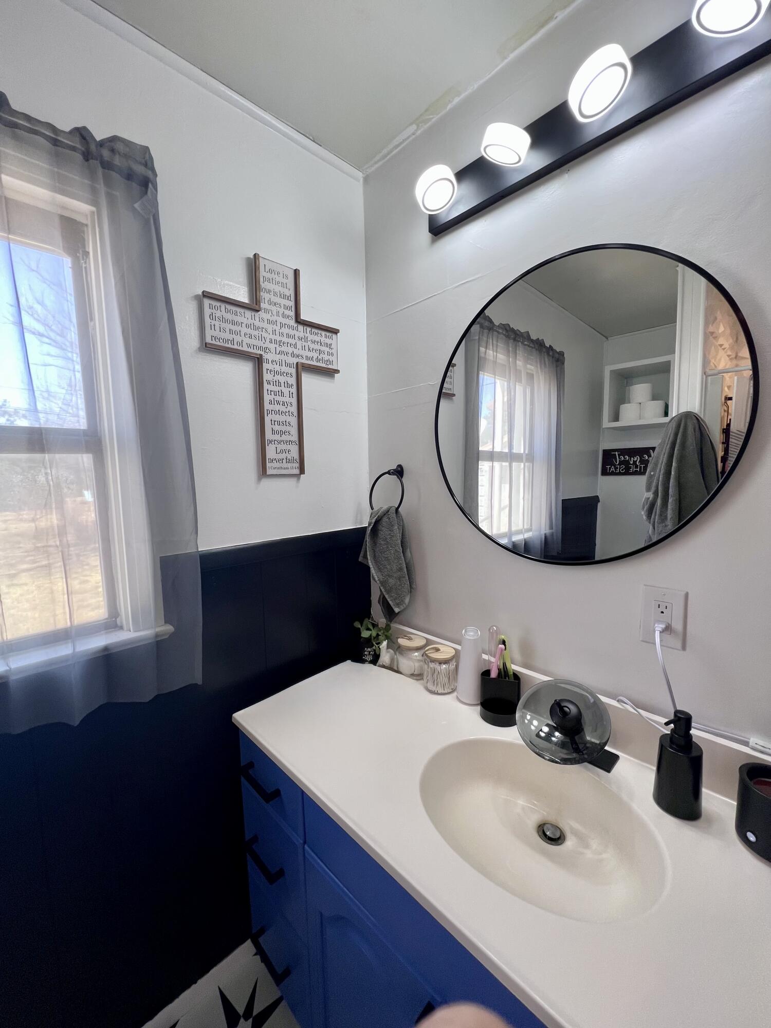502 Main Street Anton, TX 79313 - Photo 10 of 16 a bathroom with a sink and a mirror