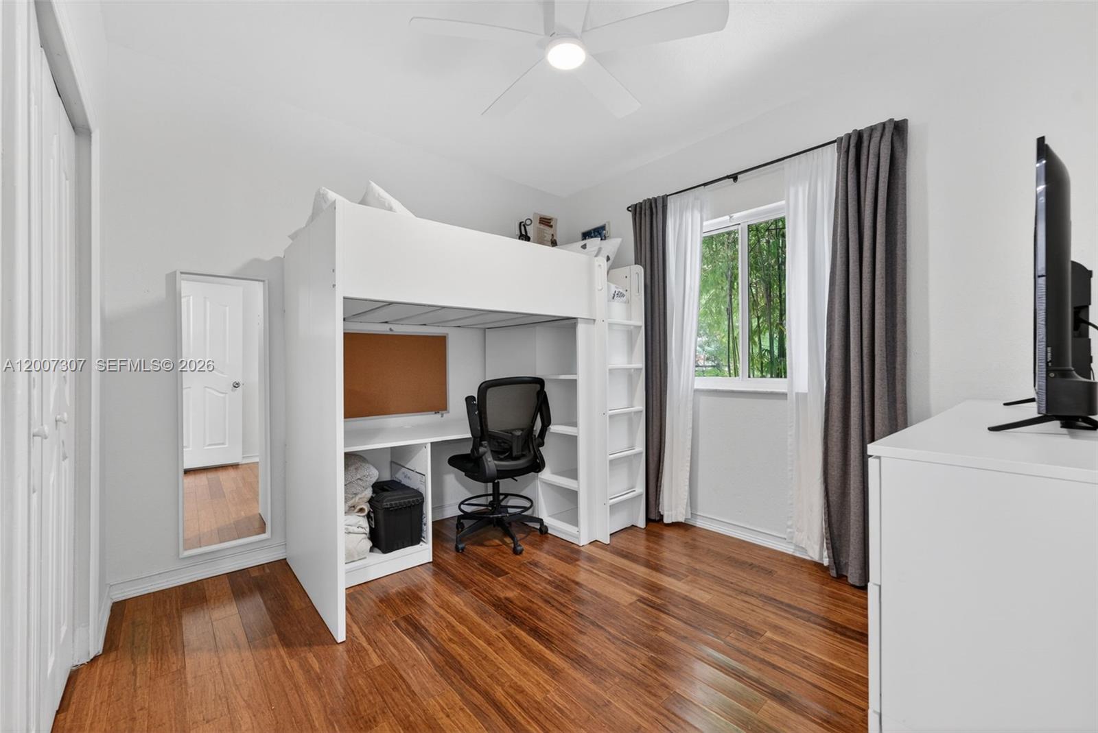 12310 Southwest 216th Street Miami, FL 33170 - Photo 15 of 22 a view of a workspace with furniture and a window
