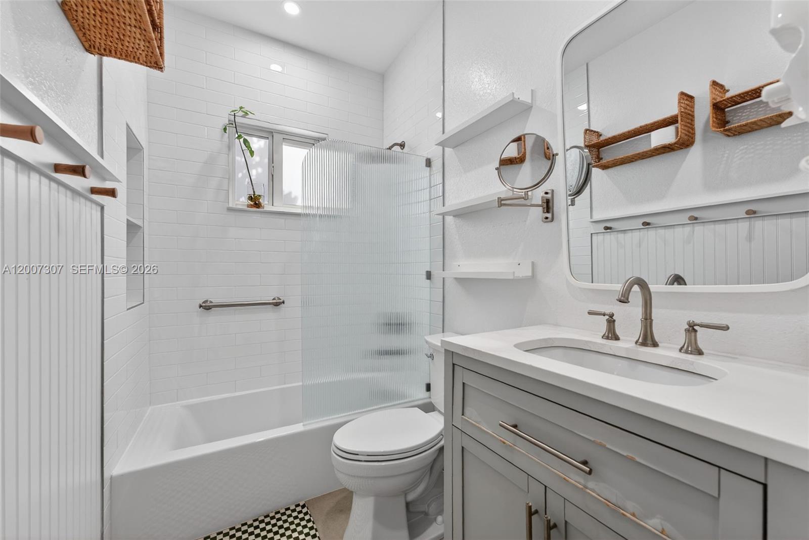 12310 Southwest 216th Street Miami, FL 33170 - Photo 16 of 22 a bathroom with a sink a toilet and shower