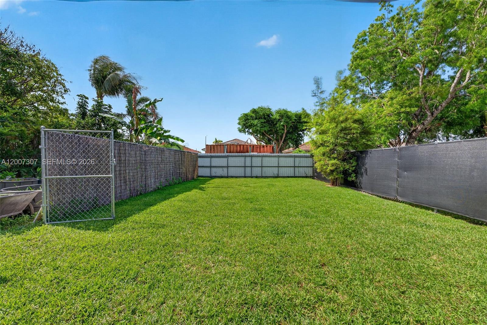 12310 Southwest 216th Street Miami, FL 33170 - Photo 18 of 22 a view of a backyard with a garden and plants