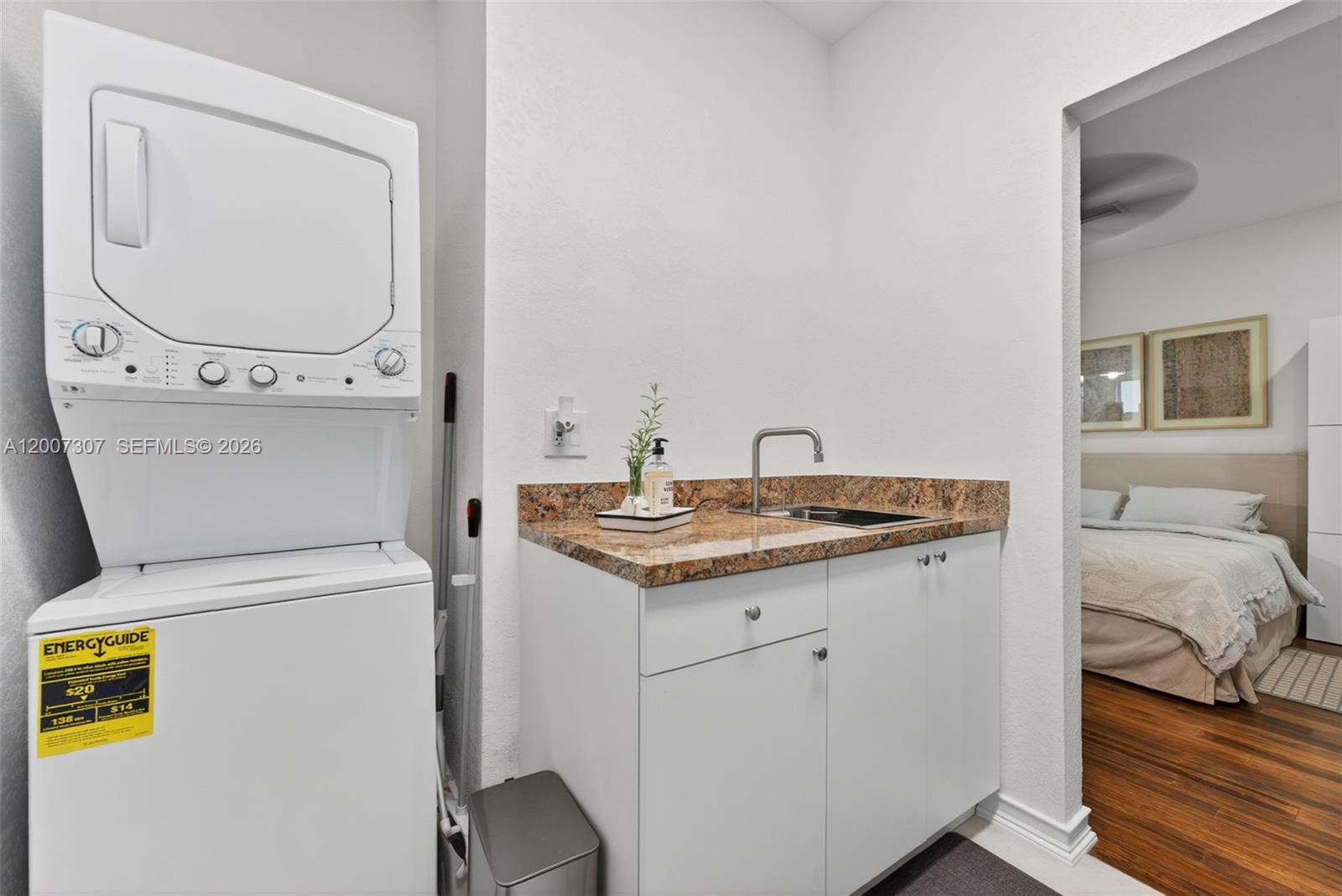 12310 Southwest 216th Street Miami, FL 33170 - Photo 22 of 22 a bathroom with a granite countertop toilet sink and mirror