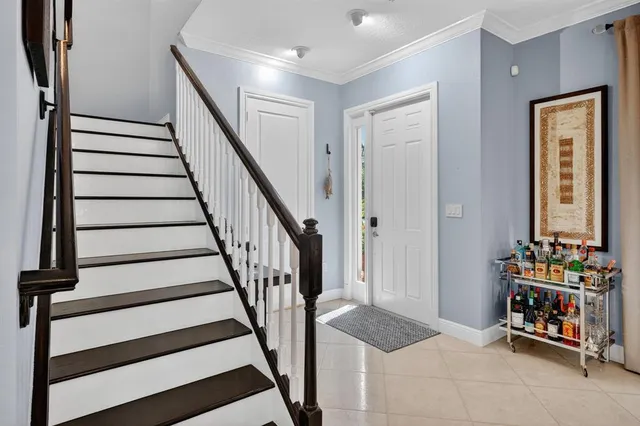 a view of room with stairs and furniture