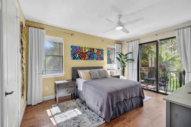 a bedroom with a bed and a flat screen television