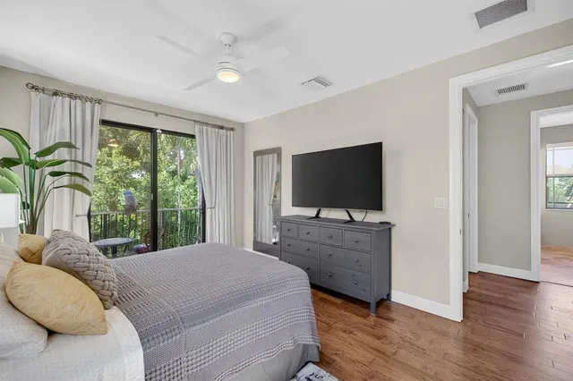 a view of a balcony with wooden floor