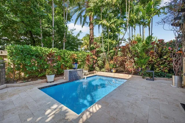 a view of a backyard with sitting area