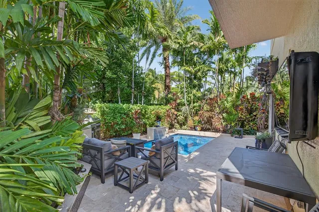 a utility room with dryer and trees
