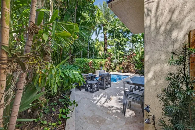 a view of a backyard with pathway