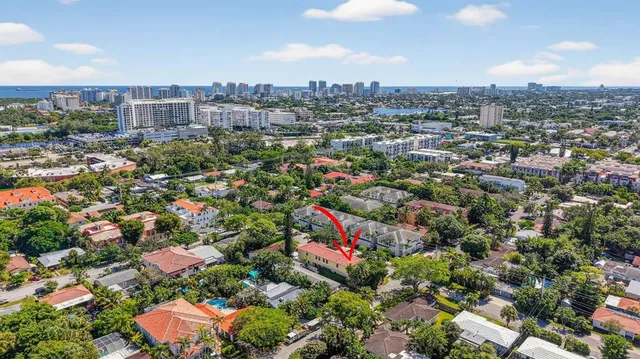 a sign that is sitting in front of flowers