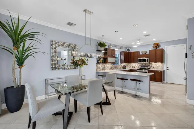 a kitchen with a table and chairs in it