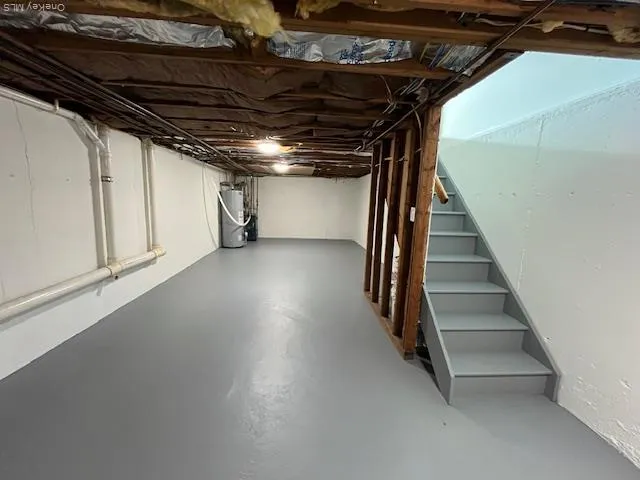 a view of an empty room with stairs