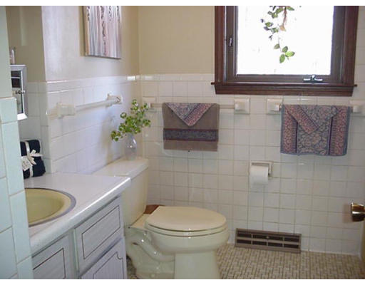 128 Allen Road Billerica, MA 01821 - Photo 15 of 16 a bathroom with a sink a toilet and a mirror