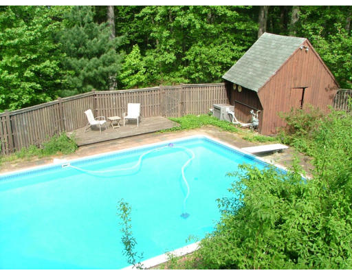 128 Allen Road Billerica, MA 01821 - Photo 16 of 16 a view of backyard with swimming pool and outdoor seating