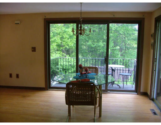 128 Allen Road Billerica, MA 01821 - Photo 3 of 16 a living room with furniture and a floor to ceiling window