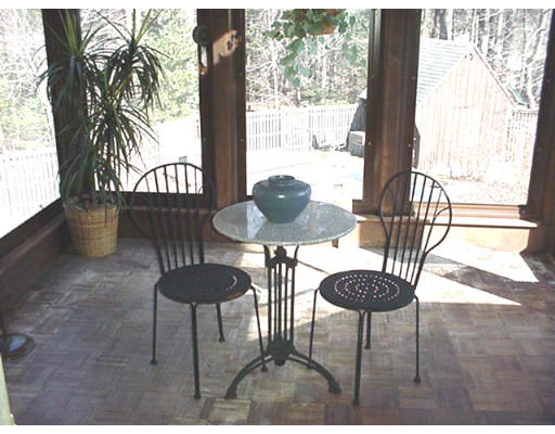 128 Allen Road Billerica, MA 01821 - Photo 8 of 16 a view of a dining room with furniture and chandelier