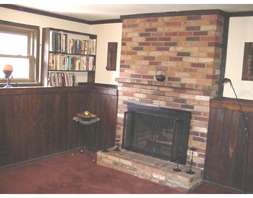 128 Allen Road Billerica, MA 01821 - Photo 10 of 16 a view of wooden floor and a fireplace in a room
