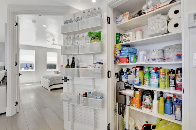 a kitchen with stainless steel appliances granite countertop a sink and a refrigerator