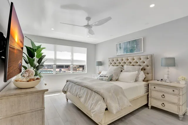 a bathroom with a sink mirror and toilet