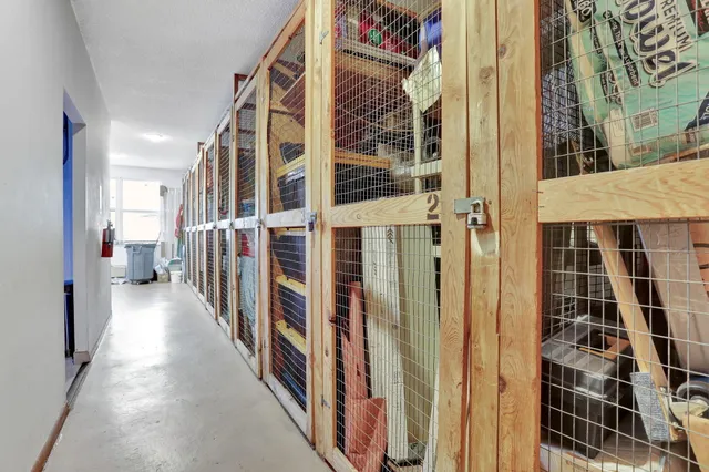 a view of washer and dryer with kitchen in the background