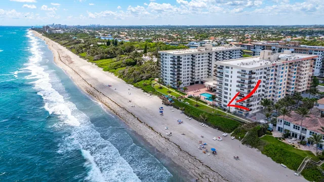 a view of swimming pool with a yard and lake view