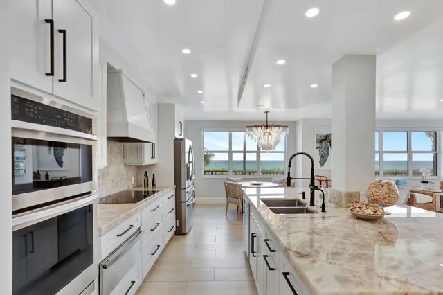 a kitchen with counter top space cabinets and stainless steel appliances