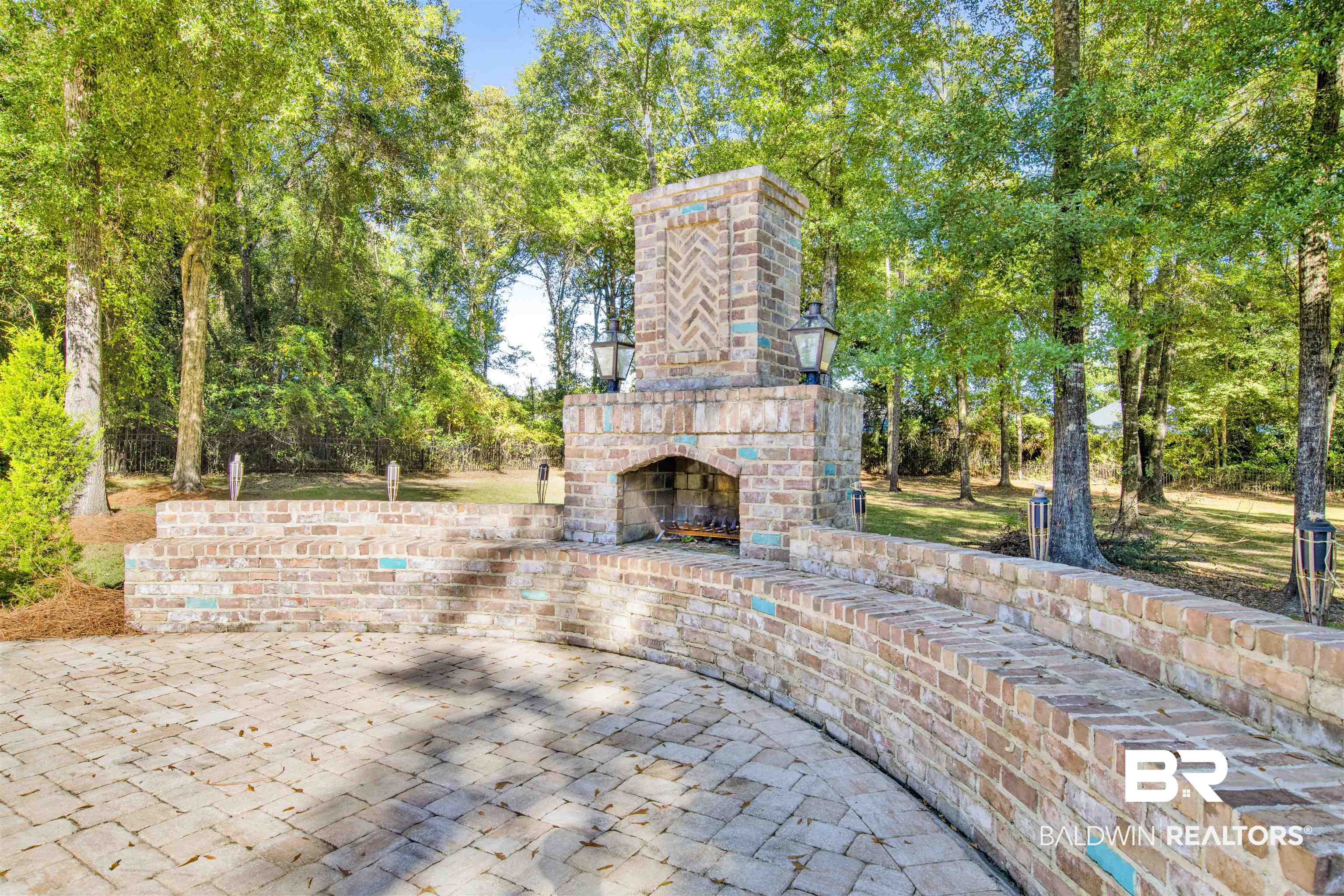 11116 Redfern Road Daphne, AL 36526 - Photo 11 of 46 View of patio / terrace featuring an outdoor brick fireplace and view of wooded area