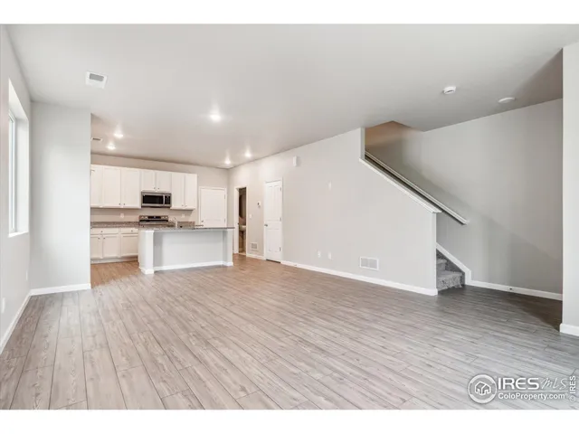 a view of kitchen with wooden floor