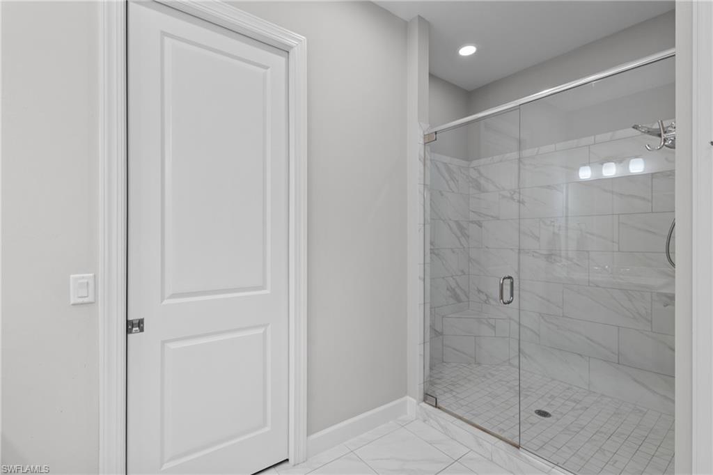 9673 Montelanico Loop, Unit 202 Naples, FL 34119 - Photo 17 of 46 a bathroom with a shower